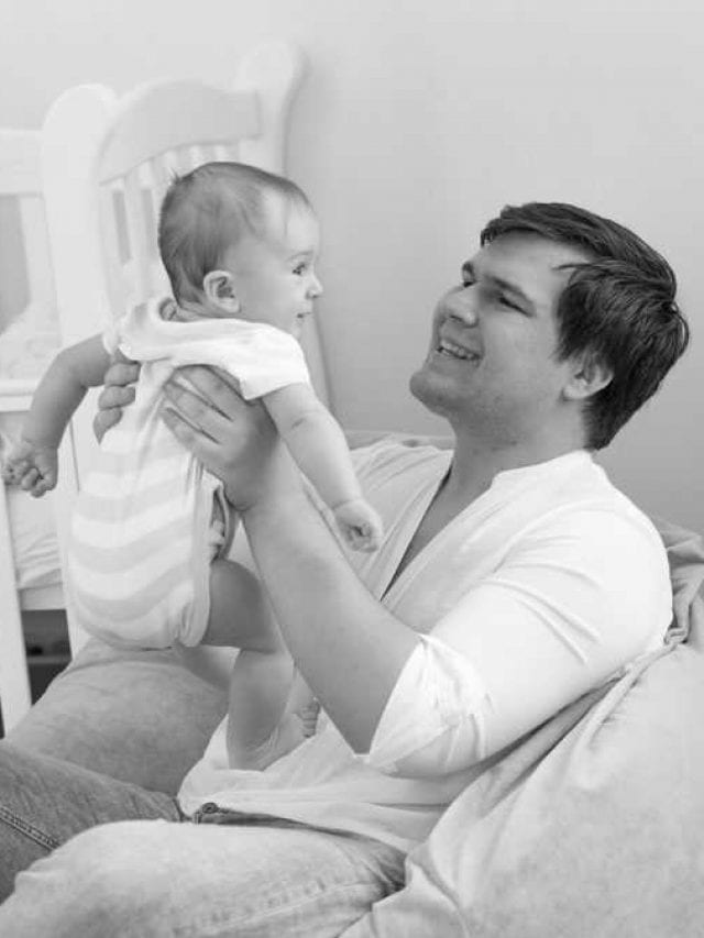 Black,And,White,Portrait,Of,Smiling,Father,Holding,His,6