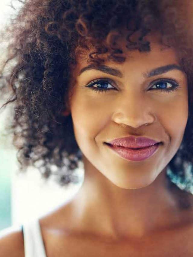 Portrait,Of,Smiling,Young,Black,Woman,With,Sunlight,Flare,And