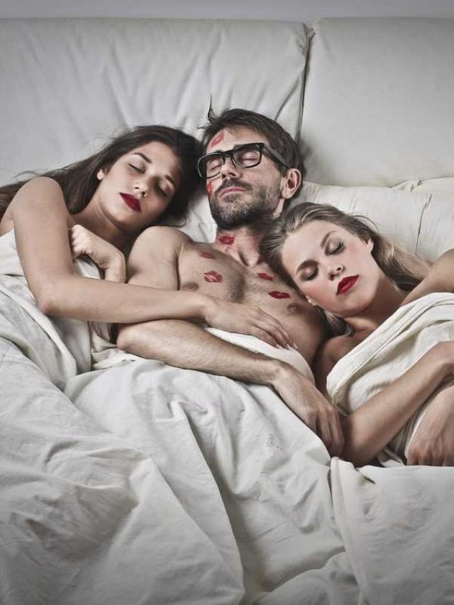 Man,Sleeping,With,Two,Women