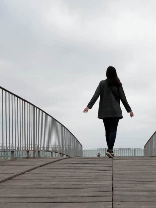 Girl,Walking,On,Bridge,Near,Seaside,In,Istanbul.,Perspective,View.