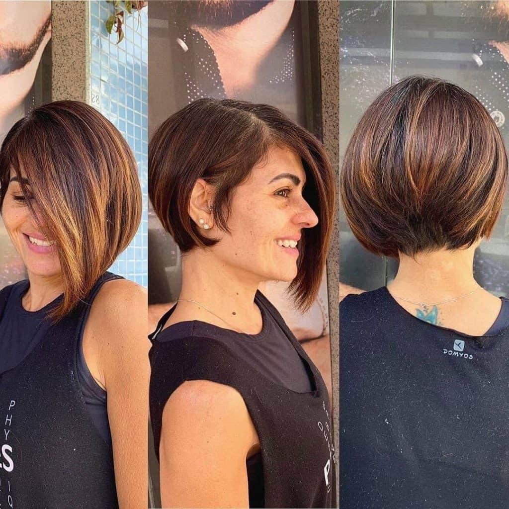 A woman with a short bob cut and a side part hairstyle.