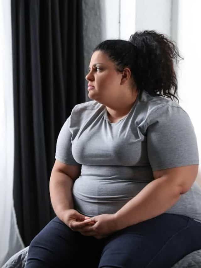 Depressed,Overweight,Woman,On,Bed,At,Home