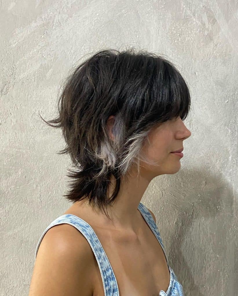 woman with short wolf cut with frosted sides highlight gray