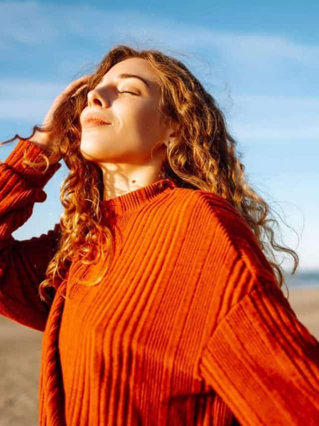 Portrait,Of,A,Beautiful,Curly,Woman,On,The,Beach,In