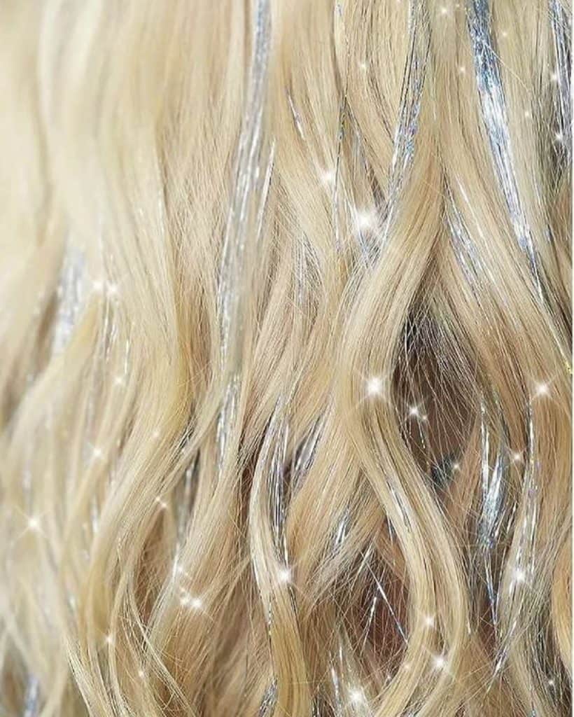 “ Add a touch of sparkle to your look with our new hair tinsel service! Shine bright this season. #hairtinsel #sparklehair #newservice