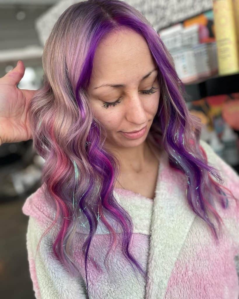 Pro Hair gradaute @beyondbeautybytia tackles tinselled and tousled locks with a piecey pink and purple colour! #hairtinsel #pinkhair__