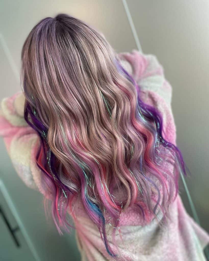 Pro Hair gradaute @beyondbeautybytia tackles tinselled and tousled locks with a piecey pink and purple colour! #hairtinsel #pinkhair__