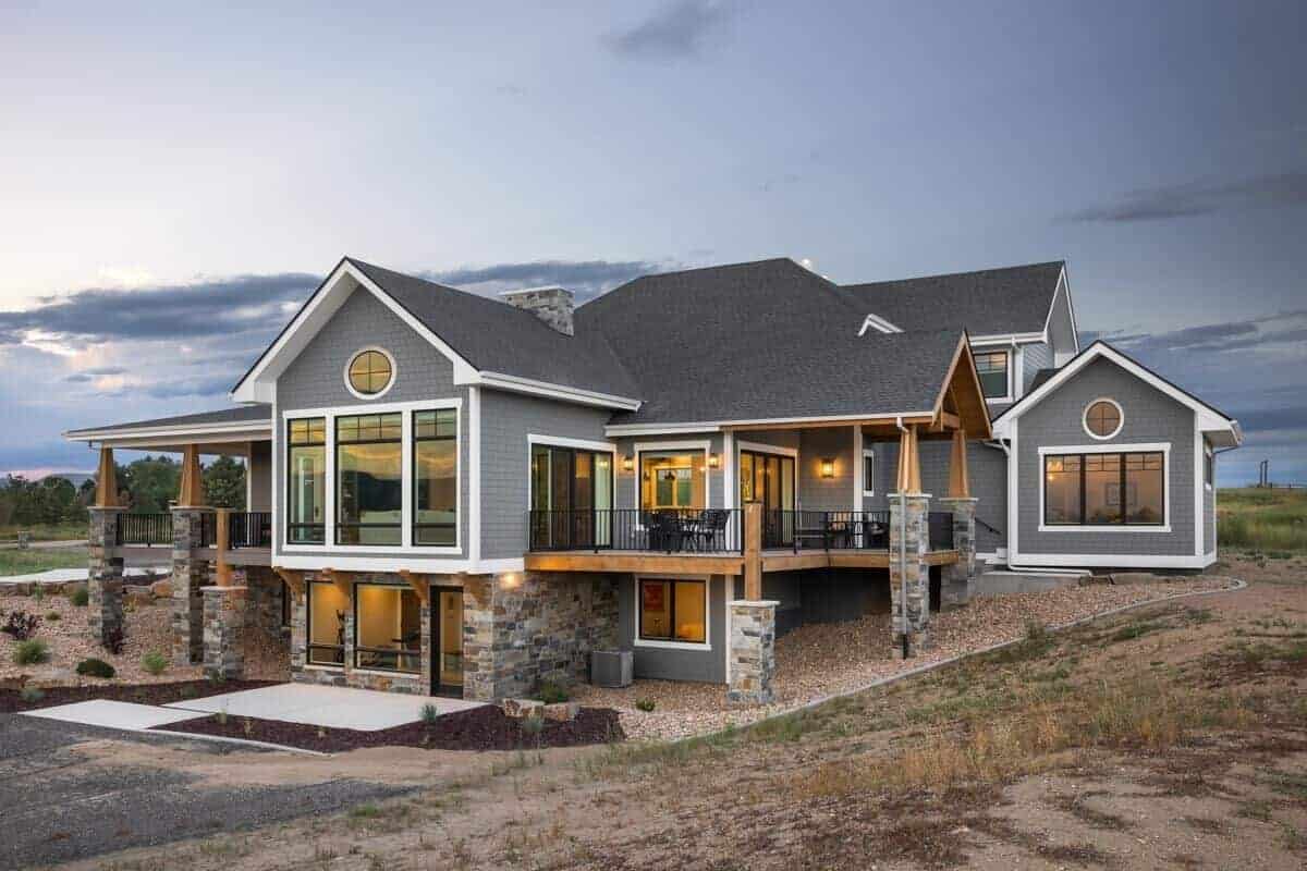 Rear-right view with a partially covered deck and a walkout basement.