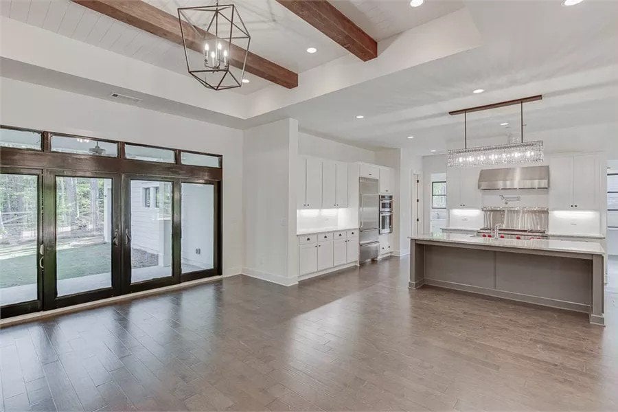 Great room and kitchen with sliding glass doors that open to the rear porch.