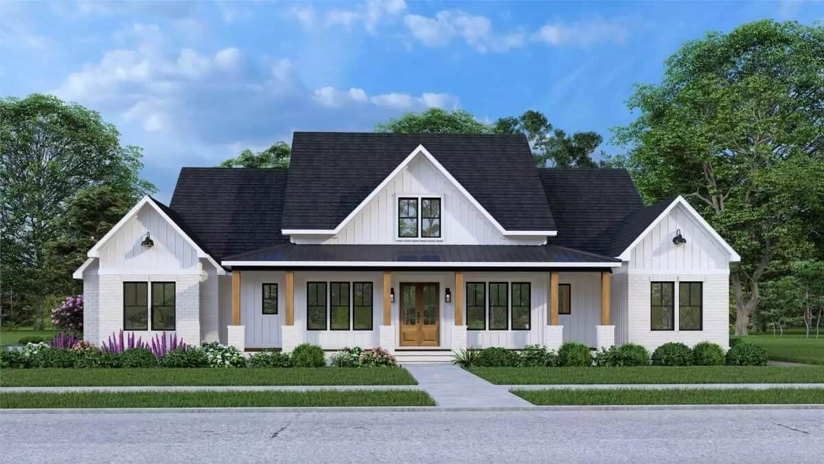 Front view with a covered entry porch topped by a center dormer.