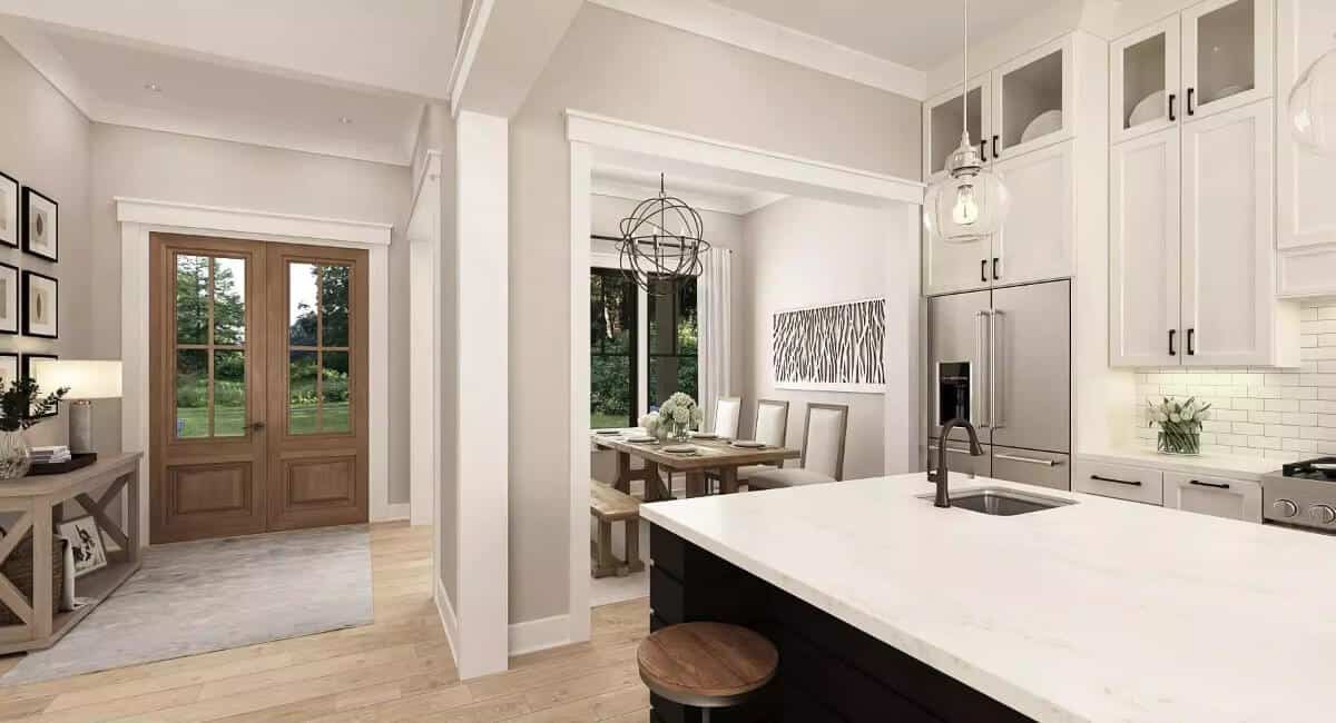 Foyer with a French front door and a wooden console table.