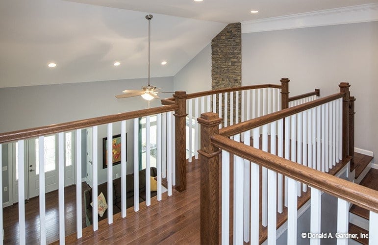 Second-floor balcony overlooking the living room below.